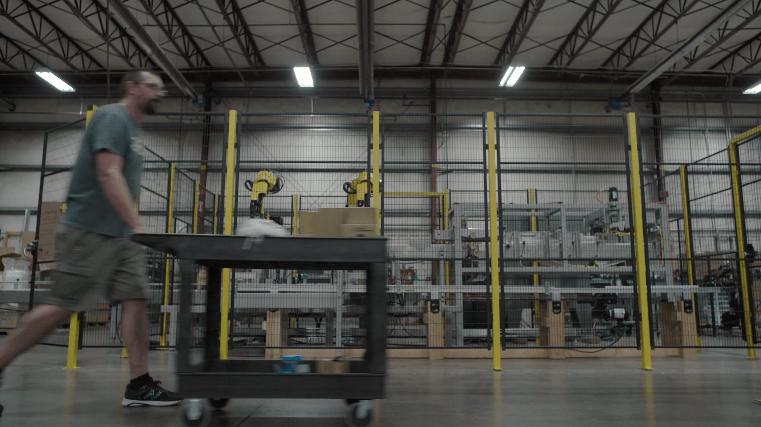 Inventory Manager pushing cart through OEM facility