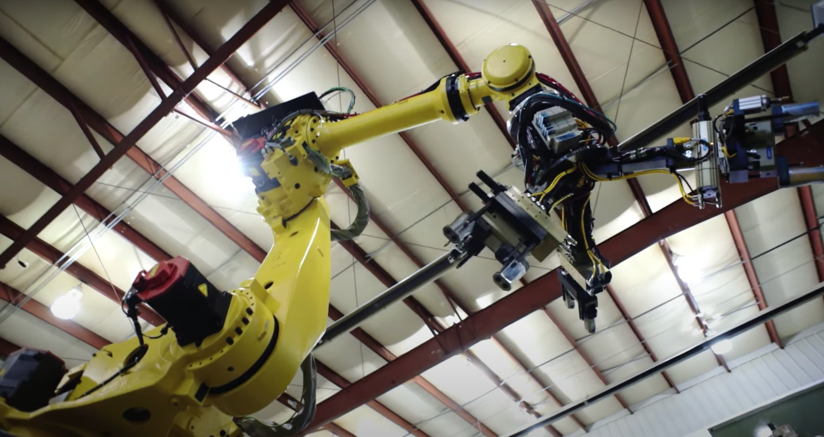 Picture of an articulated robot arm looking up.