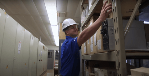 ISN Employee stocking shelf in customer storeroom as part of a parts management agreement.