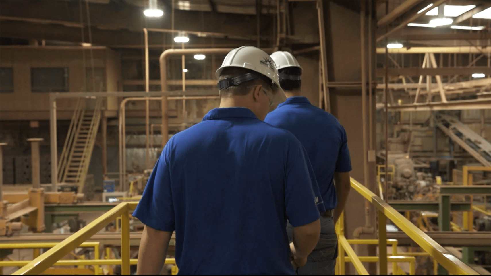 Solution Consultants network employees and customers walking through a plant