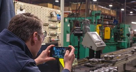 Picture of employee taking picture for lighting audit.